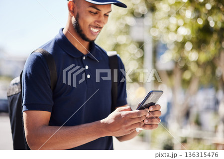 Technology, man with smartphone and in city streets for social media. Online communication or connectivity, texting conversation or happy and male person with cellphone for networking outdoors Technology, man with smartphone and in city streets for social media. Online communication or connectivity, texting conversation or happy and male person with cellphone for networking outdoors 136315476