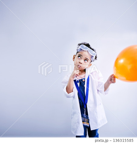 Child, thinking and balloon science in studio with .hand on chin, goggles and idea. African kid student with solution or problem solving, education or fun biology experiment on a white background 136315585