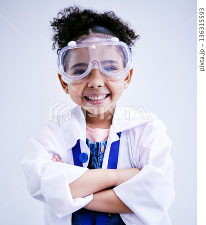 Child, portrait and happy scientist girl in studio with arms crossed, glasses and a smile. Face of a African kid student excited for medical science, education or biology experiment for future career 136315593