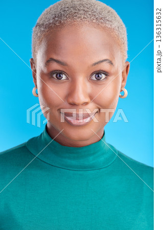 Portrait, cosmetics and black woman with confidence, smile or pride in blue studio background. Beauty, face and african female with makeup and positive mindset for fashion for wellness or glow. Portrait, cosmetics and black woman with confidence, smile or pride in blue studio background. Beauty, face and african female with makeup and positive mindset for fashion for wellness or glow. 136315632