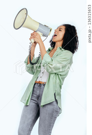Woman, megaphone and protest leader in studio with shouting, noise and politics by white background. Isolated African girl, student and audio tech for justice, speech and change in human rights goals Woman, megaphone and protest leader in studio with shouting, noise and politics by white background. Isolated African girl, student and audio tech for justice, speech and change in human rights goals 136315653