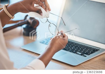 Hands, glasses and cloth for cleaning in office for dust, dirt removal and clear vision with laptop mockup space in law firm. Eyewear, lens and person with fabric to wipe spectacles for maintenance. Hands, glasses and cloth for cleaning in office for dust, dirt removal and clear vision with laptop mockup space in law firm. Eyewear, lens and person with fabric to wipe spectacles for maintenance. 136315698