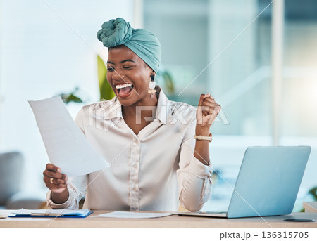 Laptop, documents and wow with a business black woman in celebration while reading her promotion contract. Success, motivation and paper with a young female employee cheering as a winner in an office Laptop, documents and wow with a business black woman in celebration while reading her promotion contract. Success, motivation and paper with a young female employee cheering as a winner in an office 136315705