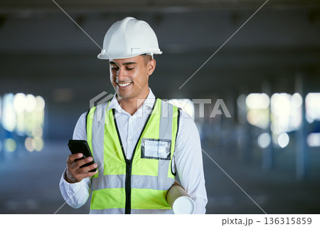 Architecture, phone and happy man with blueprint, reading email or social media at construction site in communication. Engineer with cellphone, typing message with safety and planning with smile. 136315859
