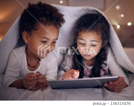 Games, night and children with a tablet in bed for cartoon, movie or streaming a show. Smile, blanket and girl kids with technology in the bedroom for the internet, education or online fun together 136315876