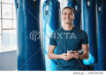 Fitness, man and gym coach with tablet ready for exercise class and training with a smile. Young male person, athlete and wellness center for personal trainer happy from workout with digital app Fitness, man and gym coach with tablet ready for exercise class and training with a smile. Young male person, athlete and wellness center for personal trainer happy from workout with digital app 136316182