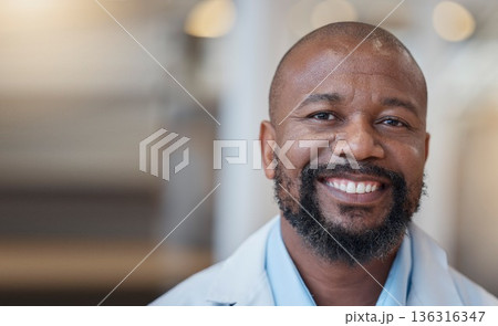 Face, black man and happy doctor in hospital for healthcare, wellness and mockup space. African medical professional, portrait and surgeon, person or employee from Nigeria with smile for health bokeh Face, black man and happy doctor in hospital for healthcare, wellness and mockup space. African medical professional, portrait and surgeon, person or employee from Nigeria with smile for health bokeh 136316347