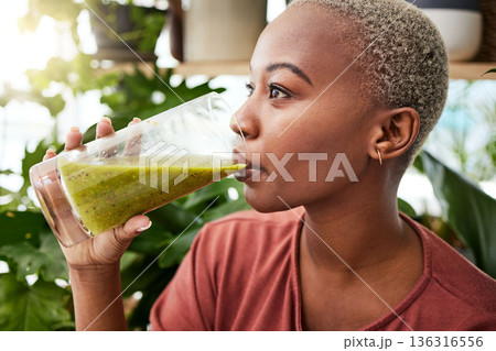 Black woman, diet and drinking natural smoothie for vitamins, fiber or health and wellness in store. Face of African female person with healthy beverage, drink or organic fruit juice to lose weight 136316556