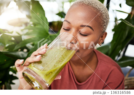 Black woman, diet and smoothie drink for vitamins, fiber or health and wellness in eco friendly store. Face of African female person drinking healthy beverage or organic fruit juice to lose weight 136316586