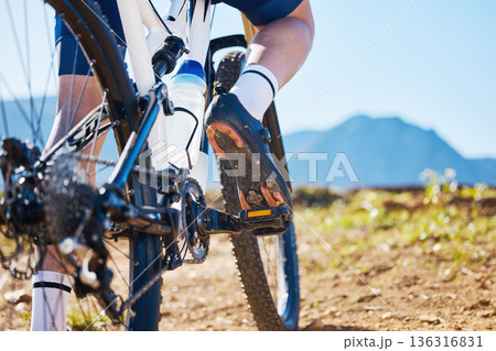 Closeup, outdoor and biker training, cycling and workout goal for wellness, road and sneakers with water bottle. Zoom, male person or cyclist with sports, nature and travel with performance or health 136316831