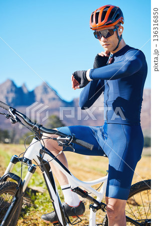 Cycling, mountain bike or man with smartwatch for pulse, exercise or fitness workout goal in training. Neck, biker or sports athlete checking timer to monitor heart rate or progress with online app Cycling, mountain bike or man with smartwatch for pulse, exercise or fitness workout goal in training. Neck, biker or sports athlete checking timer to monitor heart rate or progress with online app 136316850