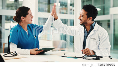 Doctor, nurse and high five in hospital for achievement, report success or residency promotion. Medical people, celebration and excited for bonus meeting, healthcare praise and teamwork results Doctor, nurse and high five in hospital for achievement, report success or residency promotion. Medical people, celebration and excited for bonus meeting, healthcare praise and teamwork results 136316953
