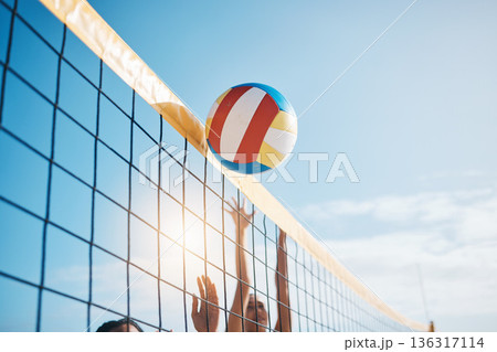 Volleyball, net with sports and fitness, blue sky and people outdoor playing game with training and summer. Exercise, athlete and competition, match with ball and active, workout and team tournament 136317114