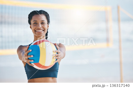 Happy woman, portrait and volleyball by net on beach for sports game, match or fitness outdoors. Fit, active or sporty female person with ball for volley exercise, training or practice by ocean coast 136317140