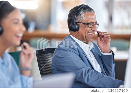 Funny, call center and senior man in office for communication, support and contact us for customer service. Advisory, telemarketing and sales agent, consultant and professional laughing in help desk. Funny, call center and senior man in office for communication, support and contact us for customer service. Advisory, telemarketing and sales agent, consultant and professional laughing in help desk. 136317169
