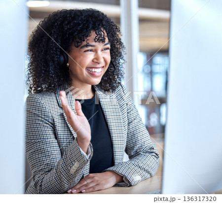 Video call, business woman and wave on computer with headphones of communication, virtual meeting or global consulting. Female office worker, smile and greeting hello at desktop for online conference 136317320