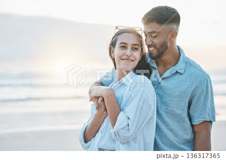 Couple, hug on beach and love, travel and holiday with mockup space and happiness together outdoor. Summer, support and care with affection, man and woman in nature with adventure by the ocean 136317365
