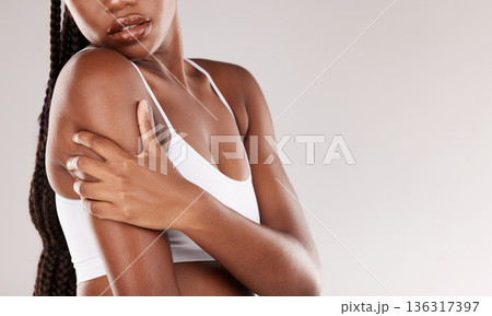 Beauty, skincare and health with shoulder of black woman in studio for wellness, spa treatment or self care. Cosmetics, dermatology and glow with closeup of model on white background for mockup space Beauty, skincare and health with shoulder of black woman in studio for wellness, spa treatment or self care. Cosmetics, dermatology and glow with closeup of model on white background for mockup space 136317397