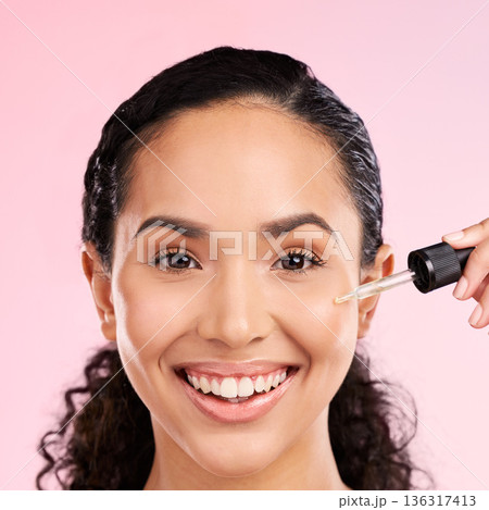 Portrait, smile and woman with oil for skincare, beauty and dermatology on a studio background. Happy, face and girl or model with a serum or collagen product for facial wellness and hyaluronic acid Portrait, smile and woman with oil for skincare, beauty and dermatology on a studio background. Happy, face and girl or model with a serum or collagen product for facial wellness and hyaluronic acid 136317413