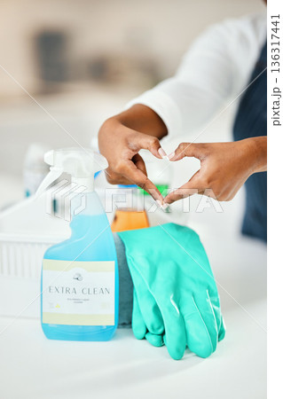 Heart hands, cleaner and chemical detergent bottle, cleaning kitchen and closeup of supplies for hygiene. Care, support and health with disinfectant spray, housekeeping and person with tools to clean Heart hands, cleaner and chemical detergent bottle, cleaning kitchen and closeup of supplies for hygiene. Care, support and health with disinfectant spray, housekeeping and person with tools to clean 136317441