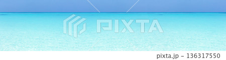 Tropical beach scene of azure crystal sea with soft waves, wild seashore. Long banner 136317550