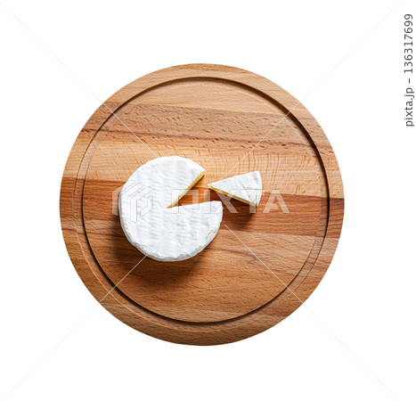 Sliced Camembert with knife on wooden cheese platter, closeup. Isolated on white Sliced Camembert with knife on wooden cheese platter, closeup. Isolated on white 136317699