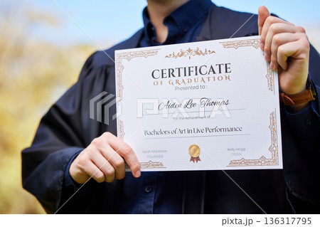 University, hands and closeup of a graduation certificate for success, achievement or goal. Scholarship, college and zoom of graduate, student or person holding degree or diploma scroll for education 136317795