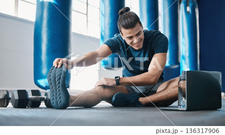 Stretching, fitness and a man with a laptop for exercise tutorial, information or a cardio video. Happy, gym and a male athlete with an online warm up on a computer before training and a workout Stretching, fitness and a man with a laptop for exercise tutorial, information or a cardio video. Happy, gym and a male athlete with an online warm up on a computer before training and a workout 136317906