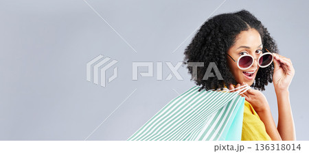 Shopping, bag and portrait of woman excited for retail sale, promotion or discount on studio, mockup or grey background. Wow, customer and girl to shop for fashion or sales on luxury clothing Shopping, bag and portrait of woman excited for retail sale, promotion or discount on studio, mockup or grey background. Wow, customer and girl to shop for fashion or sales on luxury clothing 136318014
