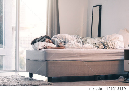 Sleeping, woman and bed with morning nap and home with rest feeling calm with peace. House, bedroom and tired female person relax and comfortable on a pillow with blanket dreaming over the weekend 136318119