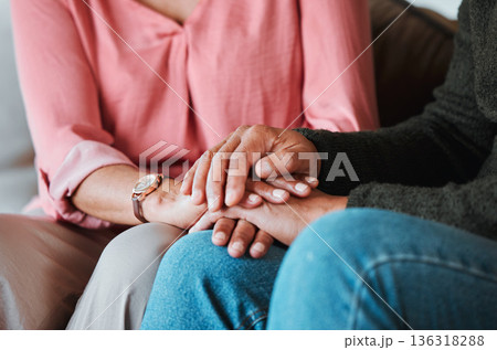 Closeup, couple and holding hands to forgive, love and care with empathy at home. Life partner, helping hand and support of man, woman and hope for kindness, trust or gratitude for therapy of anxiety 136318288