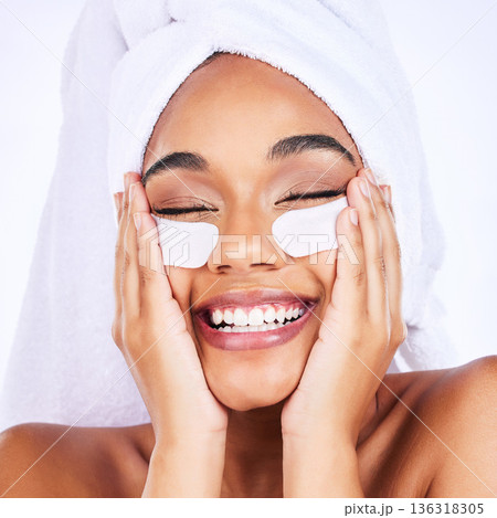 Skincare, face and woman with eye patch in studio for wellness, treatment and anti aging routine on grey background. Fine lines, collagen and female with eyes mask, smile and beauty cosmetic routine 136318305