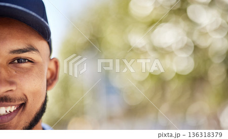Portrait, mockup and blurred background with a man in nature, outdoor during summer for adventure. Half face, smile and green space with a happy young male person wearing a cap during the day Portrait, mockup and blurred background with a man in nature, outdoor during summer for adventure. Half face, smile and green space with a happy young male person wearing a cap during the day 136318379