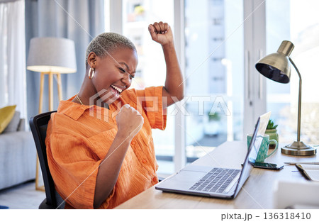 Businesswoman, laptop or winner with fist pump for winning, success or promotion bonus in home office. Happy black woman trader trading or cheering with prize, goal target or good news in remote work Businesswoman, laptop or winner with fist pump for winning, success or promotion bonus in home office. Happy black woman trader trading or cheering with prize, goal target or good news in remote work 136318410