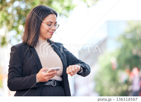Professional, woman and checking time in outdoor for meeting at office with cellphone for appointment. Schedule, planning and professional female looking at watch in city before interview in street. Professional, woman and checking time in outdoor for meeting at office with cellphone for appointment. Schedule, planning and professional female looking at watch in city before interview in street. 136318507