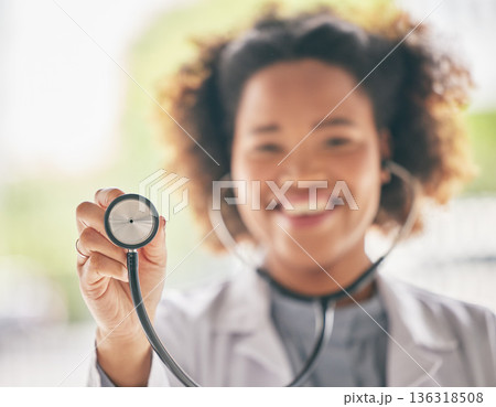 Healthcare, stethoscope and cardiology with a doctor in the hospital for a routine checkup during an appointment. Medical, hand and heart health with a woman medicine professional in a clinic Healthcare, stethoscope and cardiology with a doctor in the hospital for a routine checkup during an appointment. Medical, hand and heart health with a woman medicine professional in a clinic 136318508