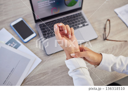 Hands, business woman and pain in wrist from typing on laptop, orthopedic injury or health risk from above. Closeup of worker, carpal tunnel and muscle problem from stress, fibromyalgia and arthritis Hands, business woman and pain in wrist from typing on laptop, orthopedic injury or health risk from above. Closeup of worker, carpal tunnel and muscle problem from stress, fibromyalgia and arthritis 136318510