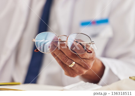 Professional, man and hands with glasses for vision or prescription lens for eyesight. Closeup, eyewear and frames male person with spectacles for wellness in workplace for focus with seeing. Professional, man and hands with glasses for vision or prescription lens for eyesight. Closeup, eyewear and frames male person with spectacles for wellness in workplace for focus with seeing. 136318511