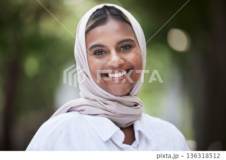 Nature, happy and portrait of Muslim woman in park for holiday, freedom and relaxing outdoors. Happiness, smile and face of Islamic female person with joy, confidence and positive mindset with hijab Nature, happy and portrait of Muslim woman in park for holiday, freedom and relaxing outdoors. Happiness, smile and face of Islamic female person with joy, confidence and positive mindset with hijab 136318512