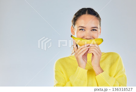 Happy, banana and portrait of woman with fruit in studio for healthy eating, wellness and diet. Food, lose weight and mockup person on white background with fruits for nutrition, detox and digestion 136318527