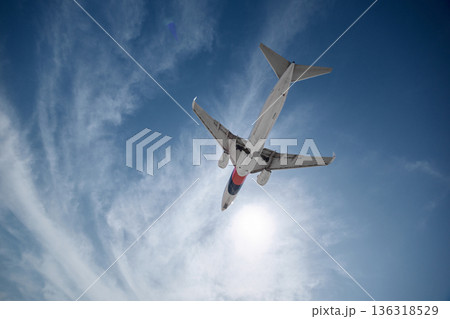 A huge passenger plane is landing in airport of Phuket, Thailand, a bottom view  136318529