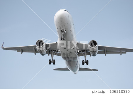 A huge passenger plane is landing in airport of Phuket, Thailand, a bottom view A huge passenger plane is landing in airport of Phuket, Thailand, a bottom view 136318550