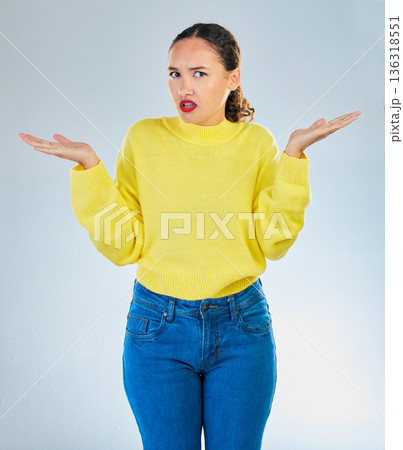 Portrait, shrug and woman confused, question and decisions against a white studio background. Female person, girl and model with confusion, why and i dont know with emoji, puzzle and choice doubt 136318551