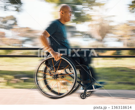 Man with a disability, wheelchair and motion of exercise in the park, nature or athlete in outdoor fitness training. Blurred background, sport and disabled person exercising or speed on wheels Man with a disability, wheelchair and motion of exercise in the park, nature or athlete in outdoor fitness training. Blurred background, sport and disabled person exercising or speed on wheels 136318614