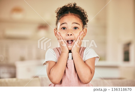 Wow portrait, reaction and a child in a house for news, announcement or excited. Shock, lounge and a young girl with a surprise expression a home living room for achievement or communication 136318670