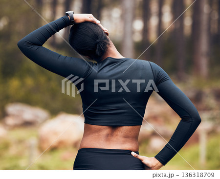 Exercise, stretching neck and back of woman in nature for fitness, training and sports in forest. Healthy body, mountain and female person getting ready with warm up, cardio workout and wellness 136318709