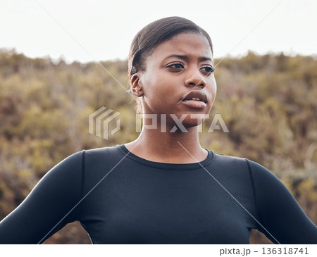 Fitness, black woman and workout in nature forest for health wellness. Training or exercise, motivation or breathing and serious female athlete in sportswear for marathon practice in woods thinking 136318741