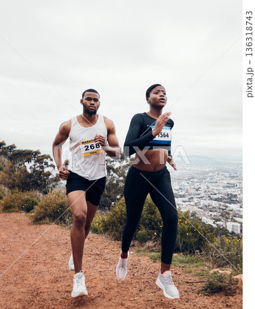 Run, couple and mountain with fitness workout and training on a race and marathon. Runner, young people and road on a exercise challenge outdoor with sport cardio performance in nature together 136318743