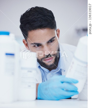 Laboratory, man or scientist reading bottle to check medical stock or info on cure breakthrough. Research study, container label or science researcher in manufacturing job with chemical inventory 136319017