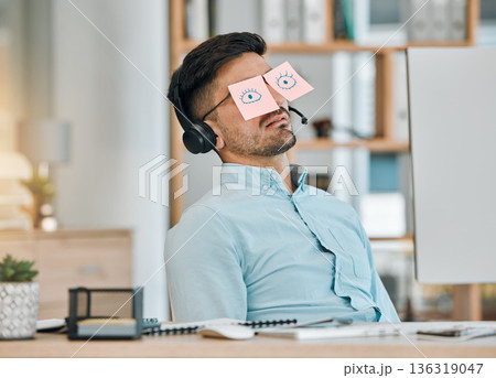 Tired, sleeping and business man with sticky note eyes from low energy and burnout at office desk. Fatigue, nap and rest of a male professional with drawing on glasses to pretend at a company Tired, sleeping and business man with sticky note eyes from low energy and burnout at office desk. Fatigue, nap and rest of a male professional with drawing on glasses to pretend at a company 136319047